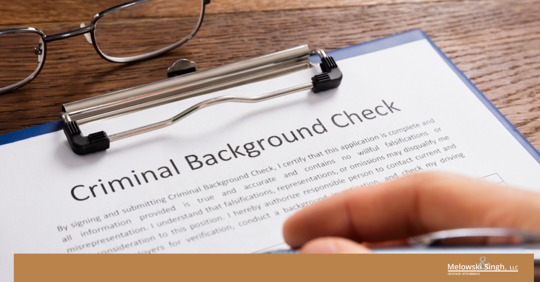 person filling out their background check criminal background check dui dwi wisconsin