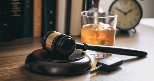 law gavel, alcohol, and car keys