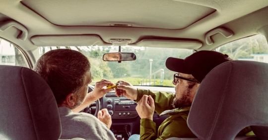 people smoking marijuana in a vehicle
