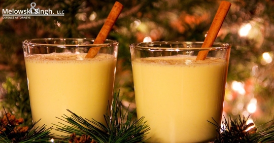fancy holiday drinks by christmas tree