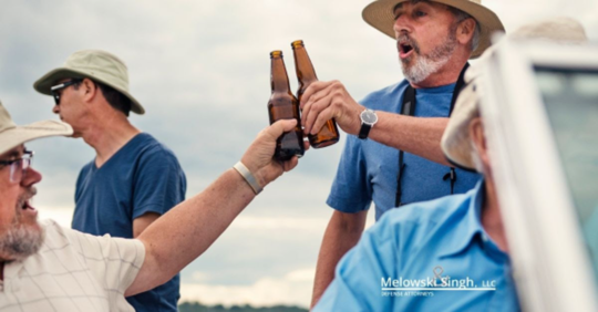 Men cheersing beers on a boat